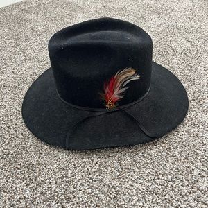 Feathered black cowboy hat